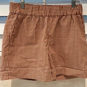 Elastic waist, gingham shorts. 15 inches from waist to hem.